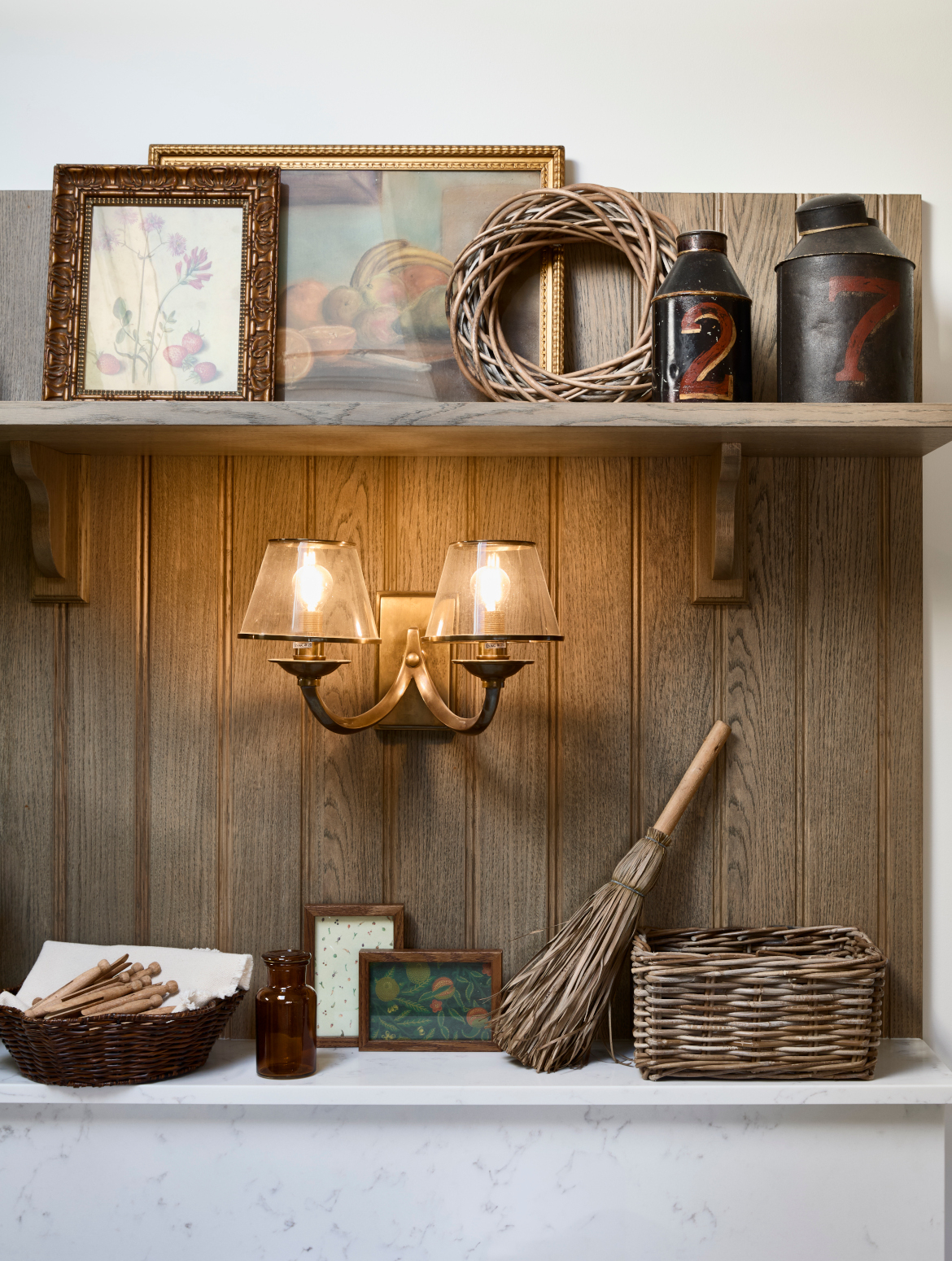 A traditional bootroom-cum-larder. The Belfast sink and worktop sits beneath two mounted cupboards. A antique brass Perin & Rowe Tap features. 